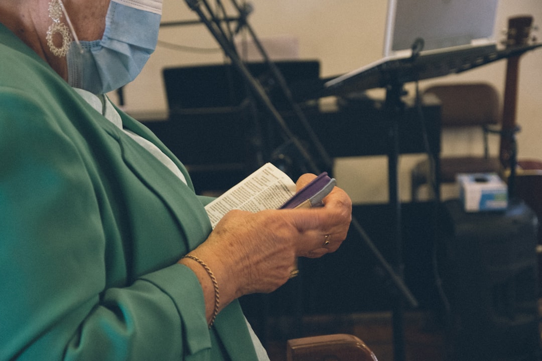 Person using smartphone for church services
